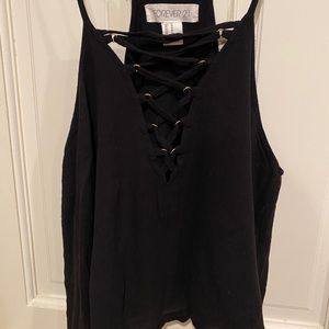 Black cropped spaghetti strap sleeveless top.